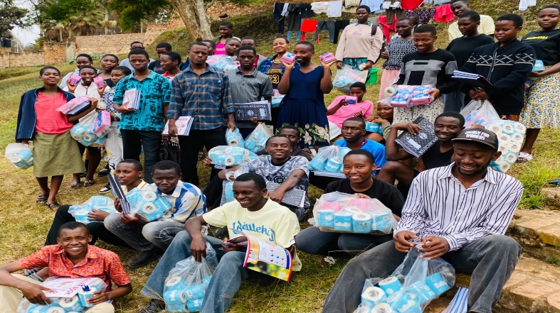 Students holding the scholastic materials they received